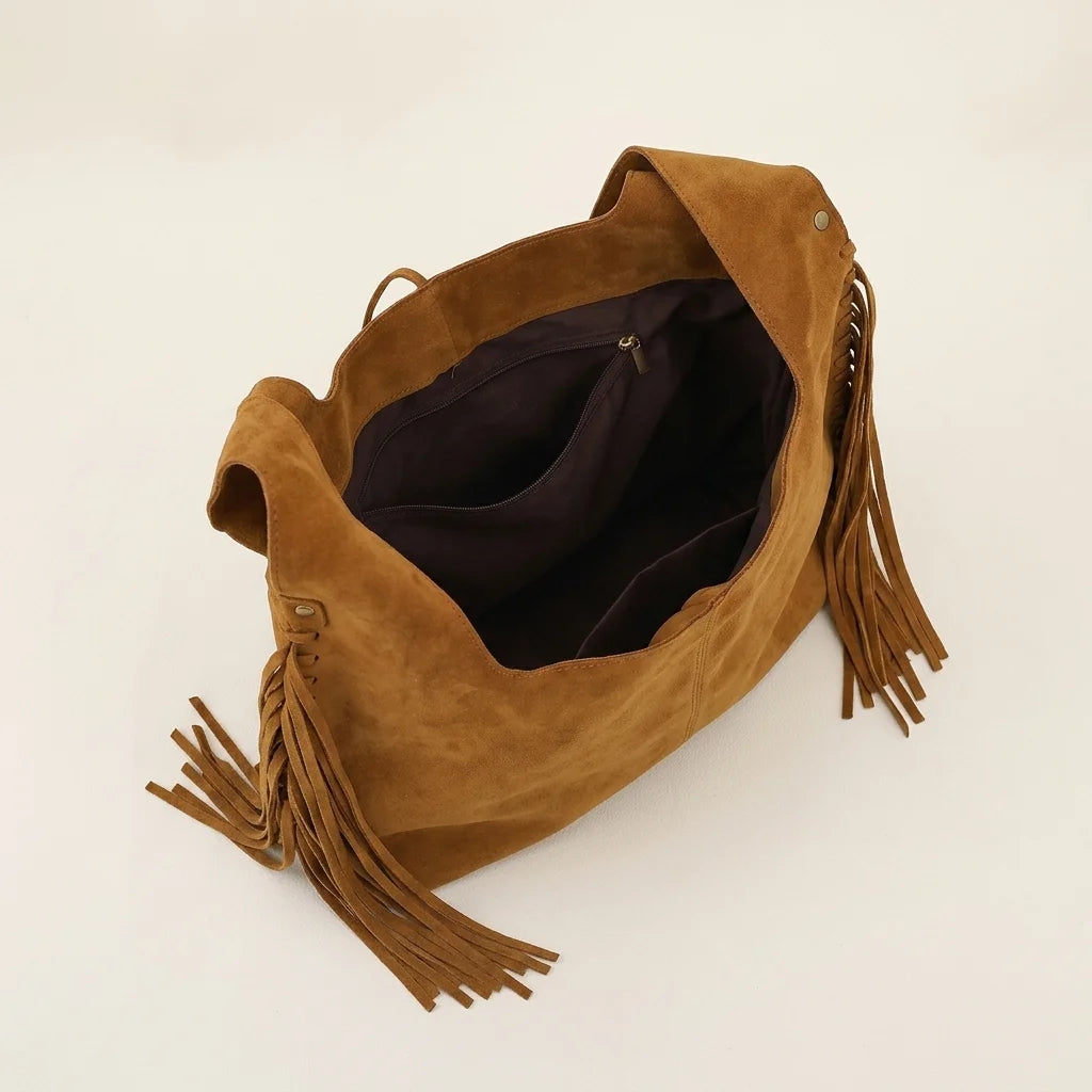 Interior lining and pockets of Brown bag with fringe tassel