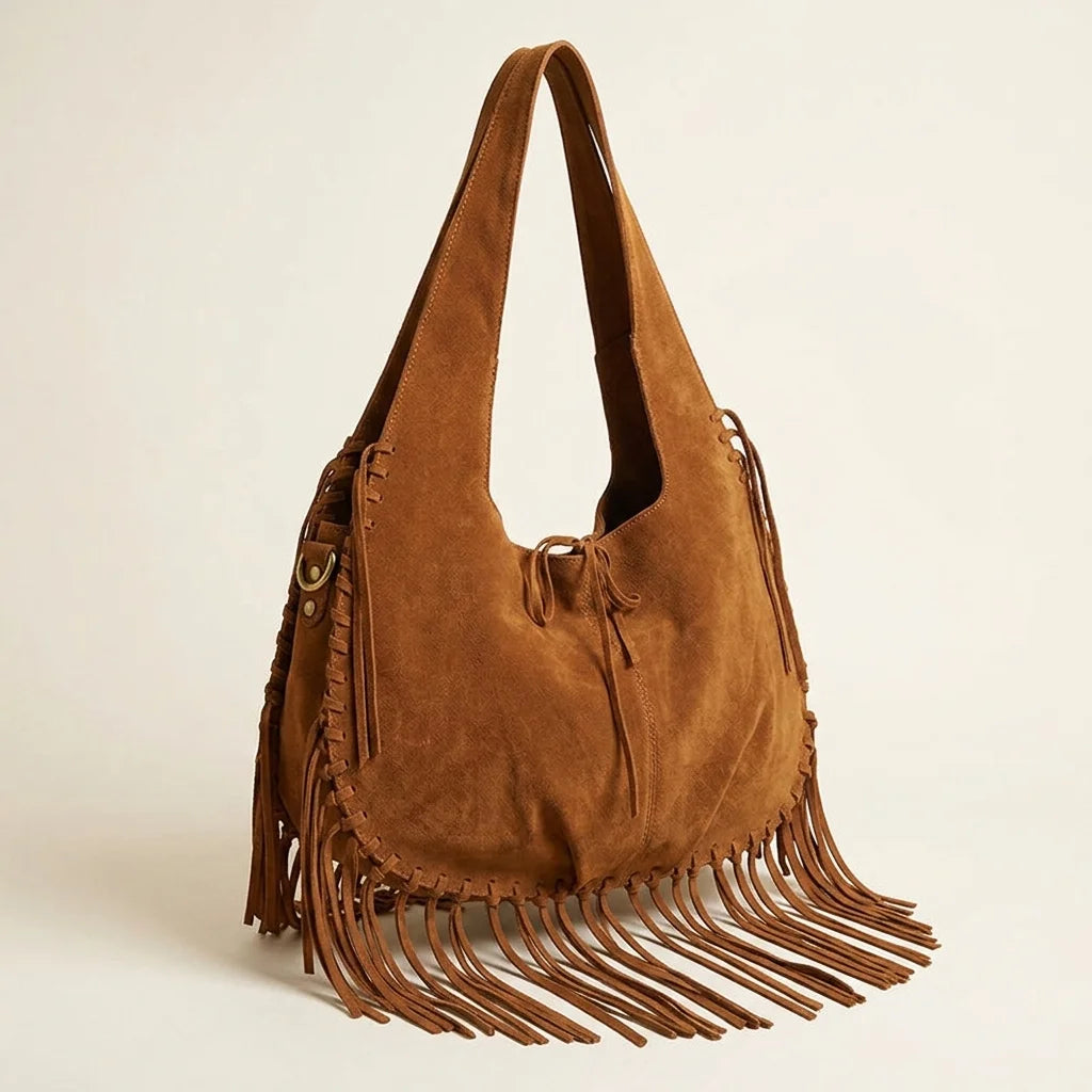 Brown bag with fringe tassel, three-quarter angle showing side depth
