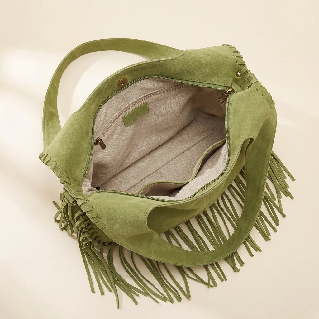 Interior lining and pockets of Green bag with fringe tassel