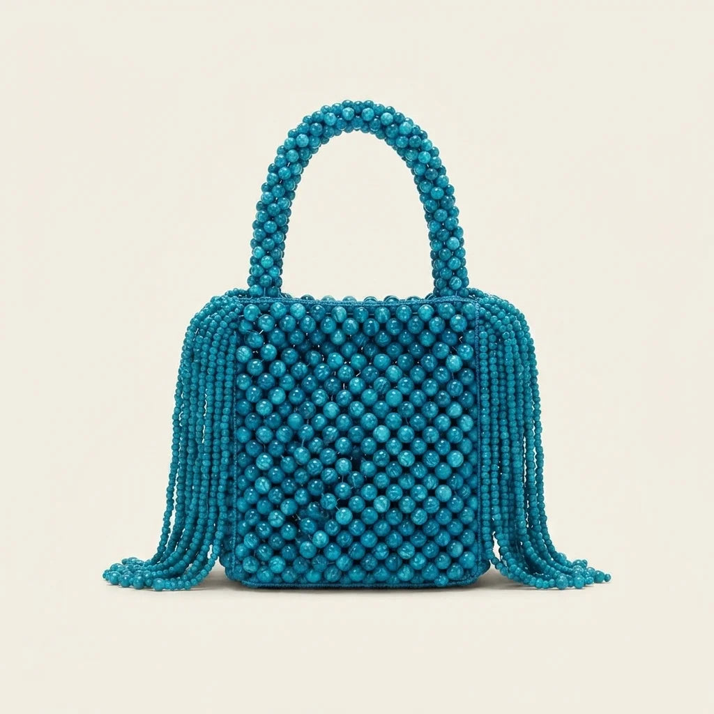 Back panel of Blue beaded fringe clutch bag with strap attachments