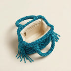 Interior lining and pockets of Blue beaded fringe clutch bag