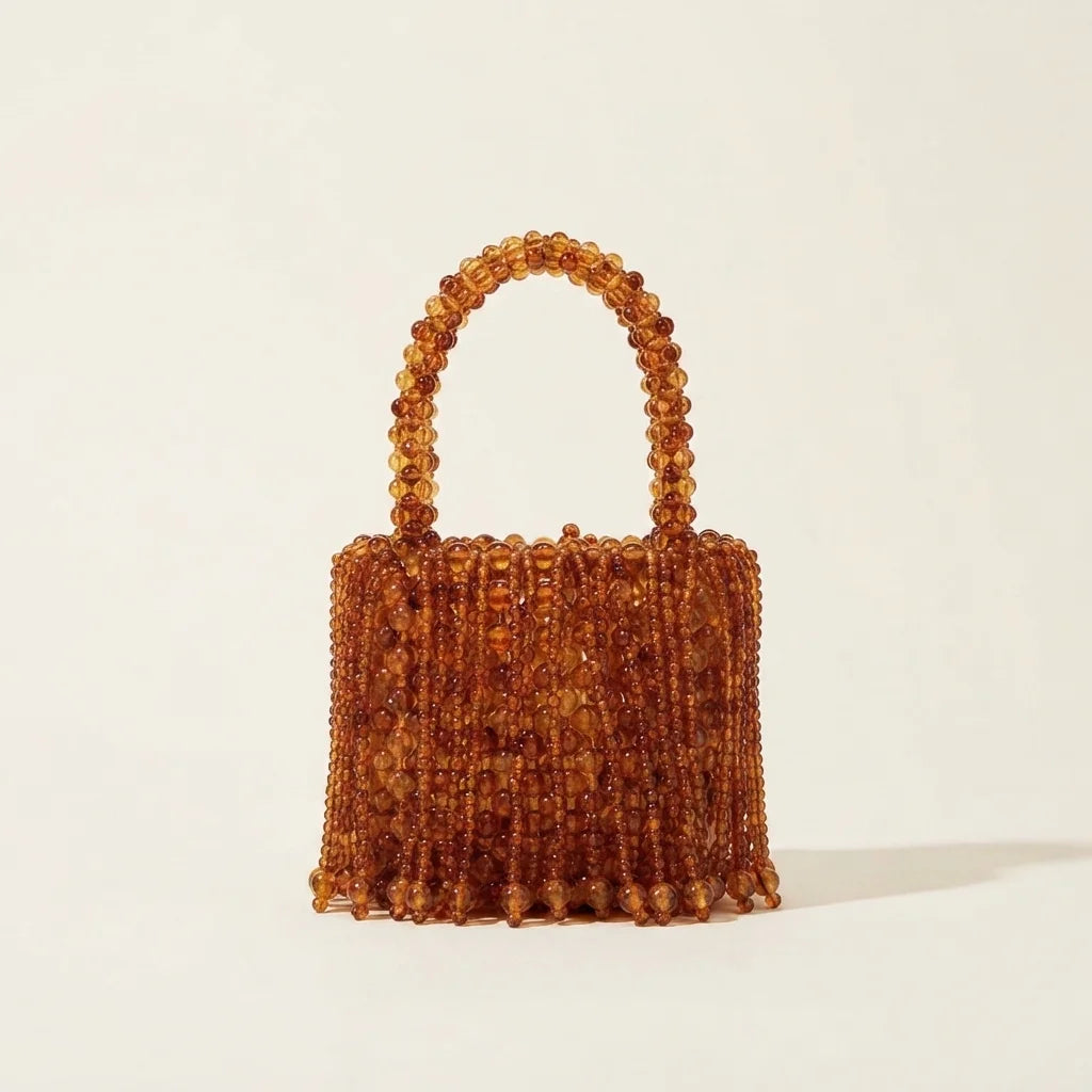 Back panel of Brown beaded fringe clutch bag with strap attachments