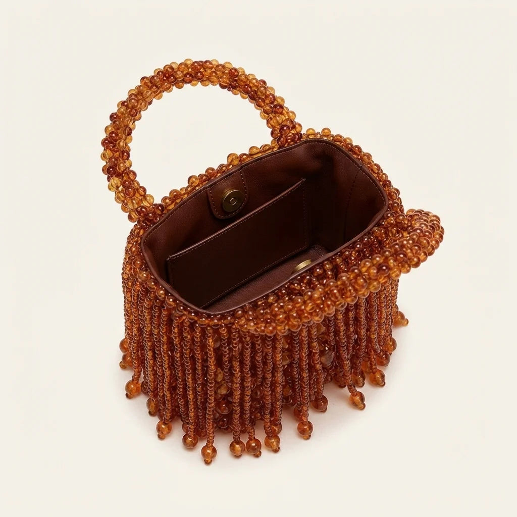 Interior lining and pockets of Brown beaded fringe clutch bag