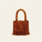 Brown beaded fringe clutch bag, three-quarter angle showing side depth