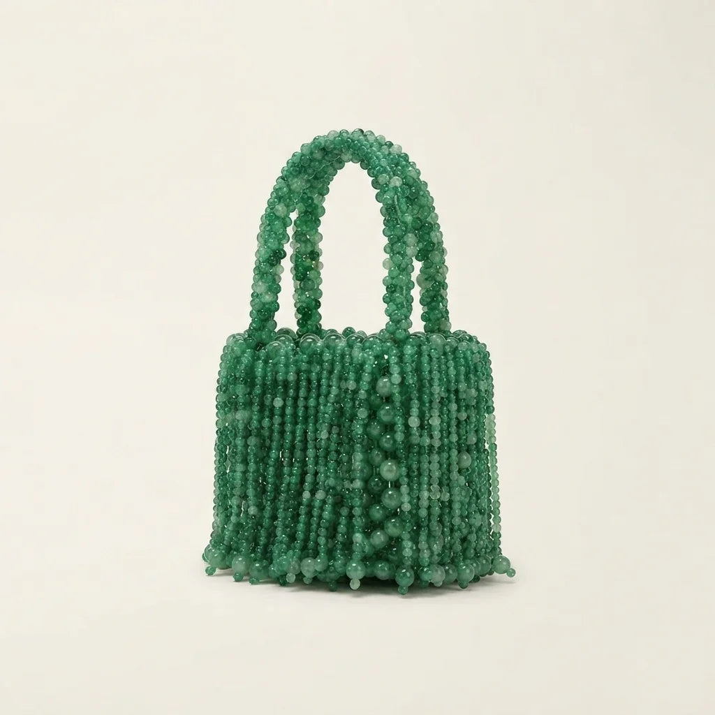 Green beaded fringe clutch bag, three-quarter angle showing side depth