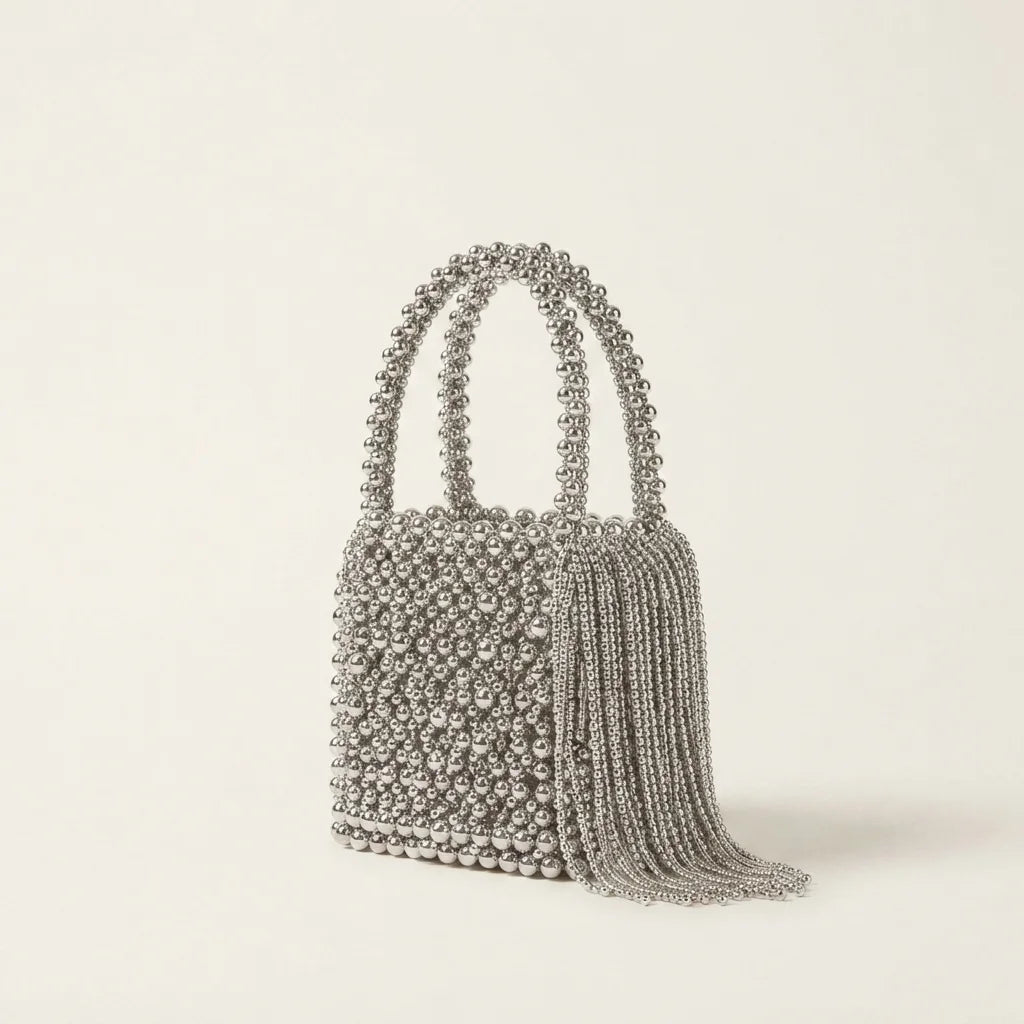 Silver Grey beaded fringe clutch bag, three-quarter angle showing side depth