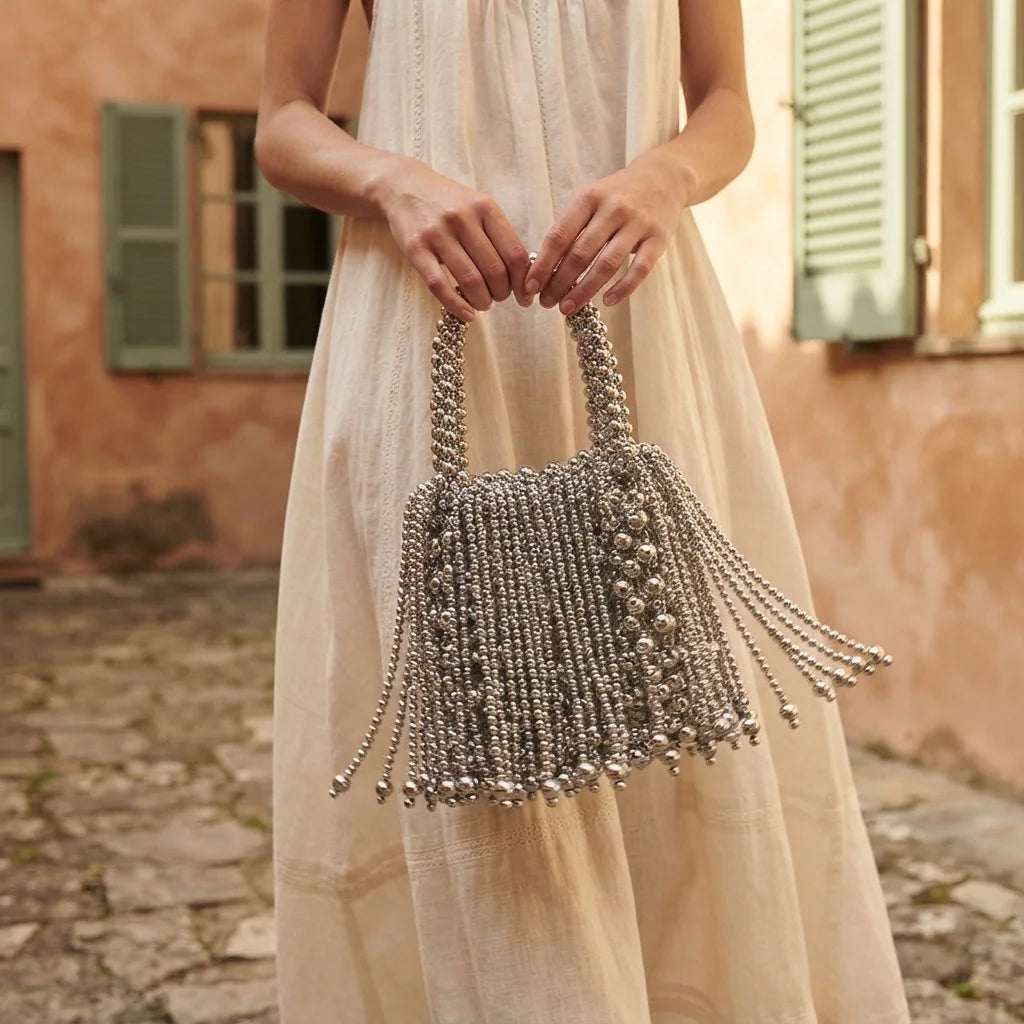 Woman wearing Silver Grey beaded fringe clutch bag with swaying fringe