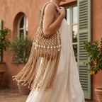 Woman wearing Khaki beaded fringe shoulder bag with swaying fringe