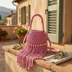 Pink beaded fringe shoulder bag styled in a warm Mediterranean setting