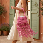 Woman wearing Pink beaded fringe shoulder bag with swaying fringe