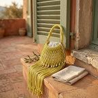 Yellow beaded fringe shoulder bag styled in a warm Mediterranean setting