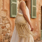 Woman wearing Yellow beaded fringe shoulder bag with swaying fringe