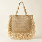 Back panel of Beige beige fringe tote bag with strap attachments
