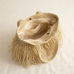 Interior lining and pockets of Beige beige fringe tote bag