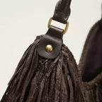 Close-up of fringe stitching and texture on Chocolate big brown fringe bag