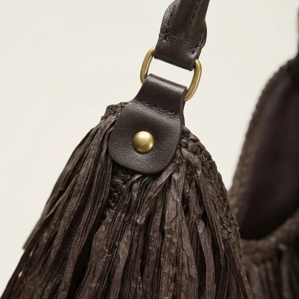 Close-up of fringe stitching and texture on Chocolate big brown fringe bag