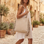 Woman wearing Beige big fringed shoulder bag with swaying fringe