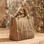 Khaki big fringed shoulder bag, three-quarter angle showing side depth