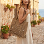 Woman wearing Khaki big fringed shoulder bag with swaying fringe