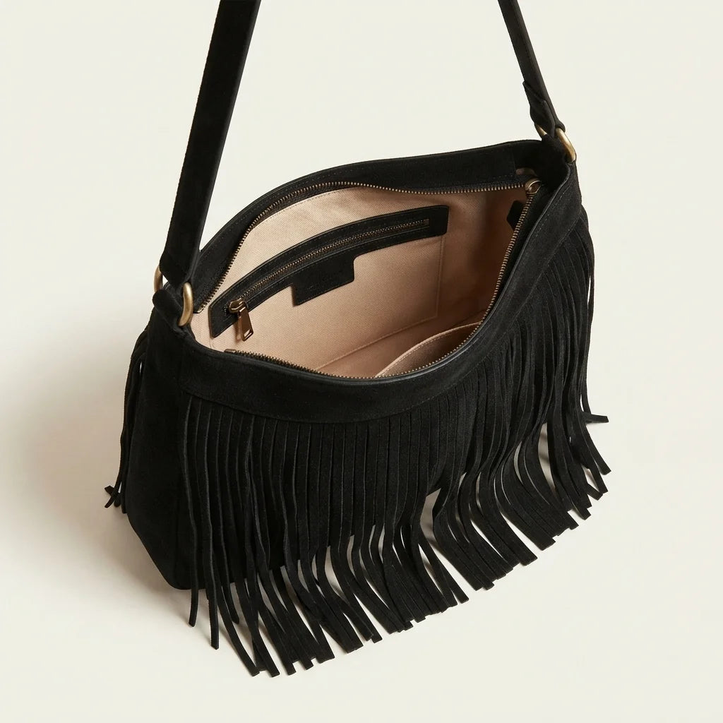Interior lining and pockets of Black black fringe bag suede