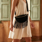 Woman wearing Black black fringe belt bag with swaying fringe