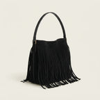 Black black fringe bucket bag, three-quarter angle showing side depth