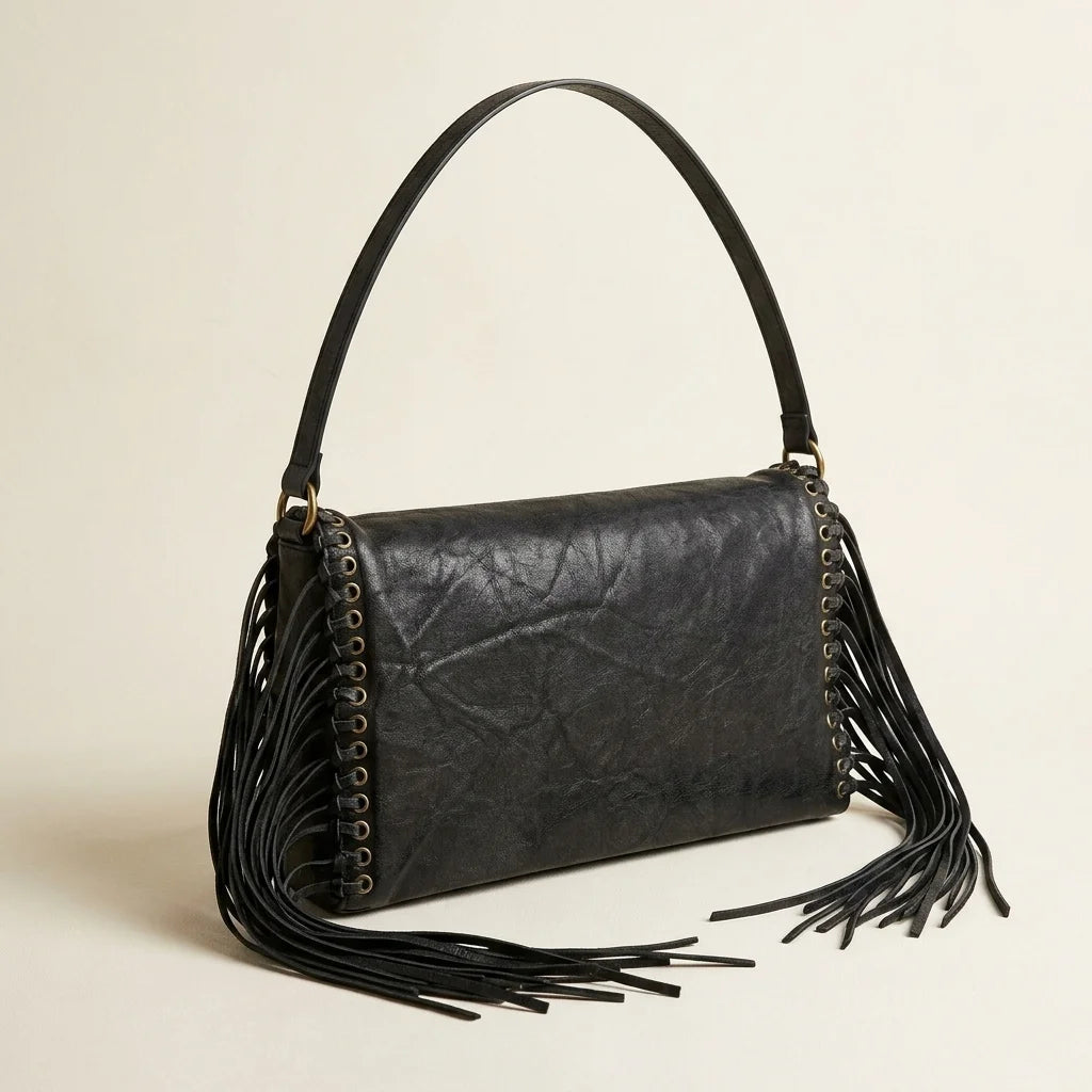 Black black fringe clutch bag, three-quarter angle showing side depth