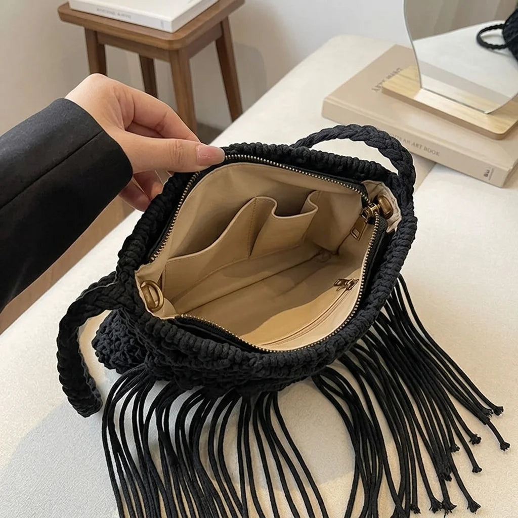 Interior lining and pockets of Black black fringe over the shoulder bag