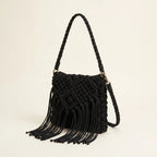 Black black fringe over the shoulder bag, three-quarter angle showing side depth