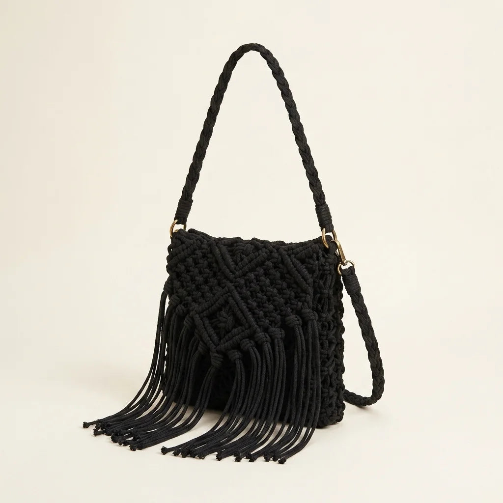 Black black fringe over the shoulder bag, three-quarter angle showing side depth