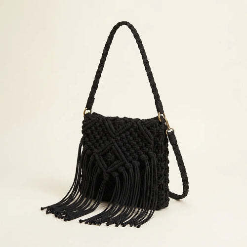 Black black fringe over the shoulder bag, three-quarter angle showing side depth