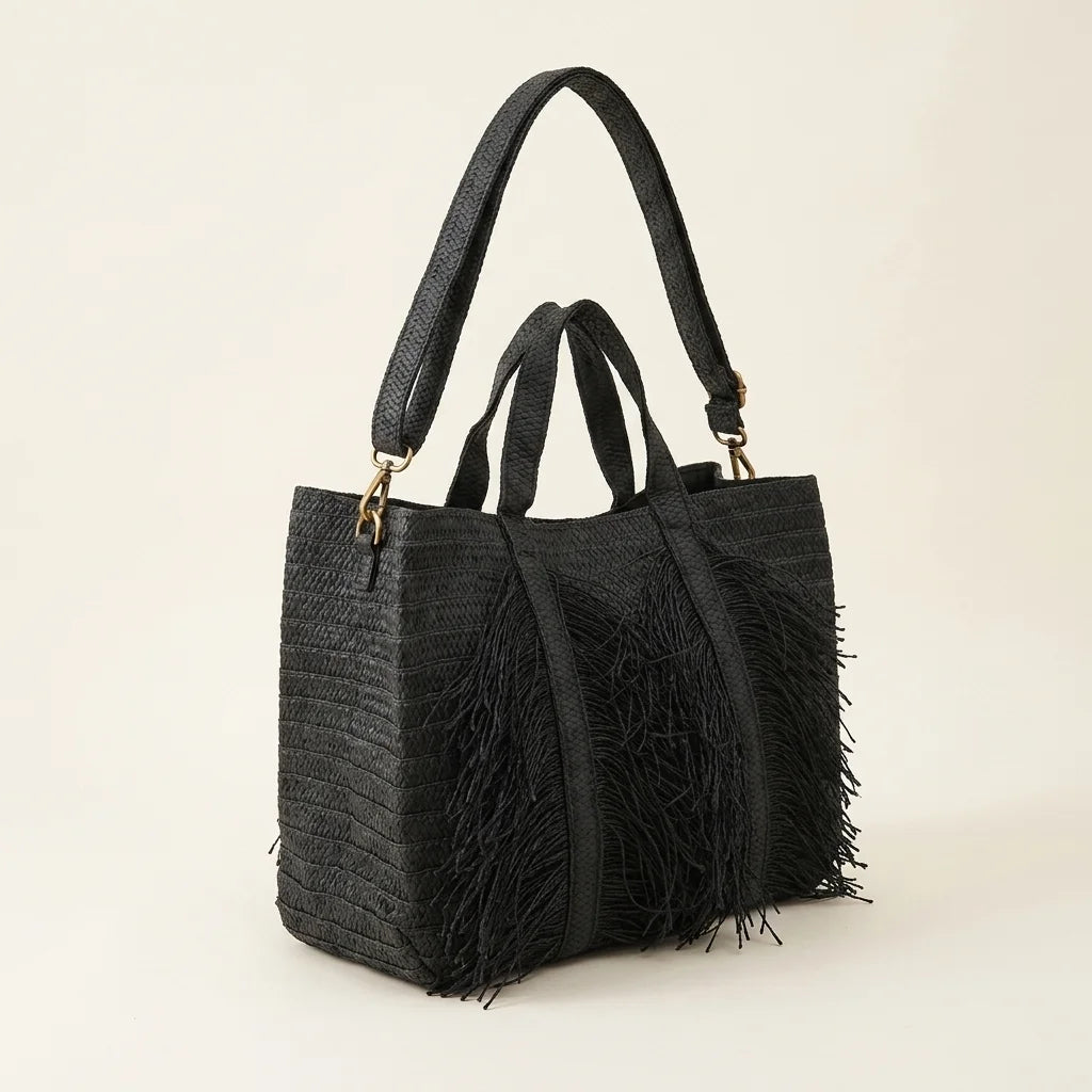 Black black fringe tote bag, three-quarter angle showing side depth