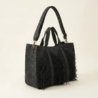 Black black fringe tote bag, three-quarter angle showing side depth