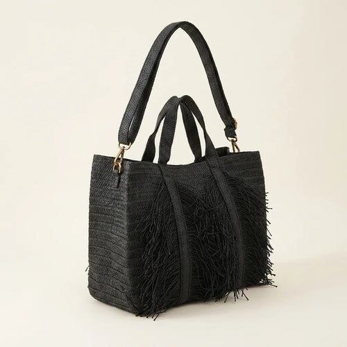 Black black fringe tote bag, three-quarter angle showing side depth