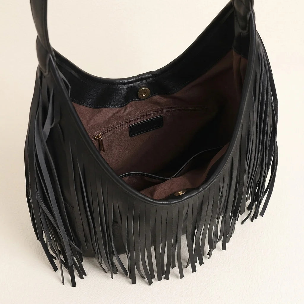 Interior lining and pockets of Black black leather fringe bag