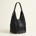 Black black leather fringe bag, three-quarter angle showing side depth
