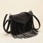 Black black leather fringe crossbody bag, three-quarter angle showing side depth