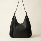 Back panel of Black black leather fringe hobo bag with strap attachments