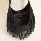Interior lining and pockets of Black black leather fringe hobo bag