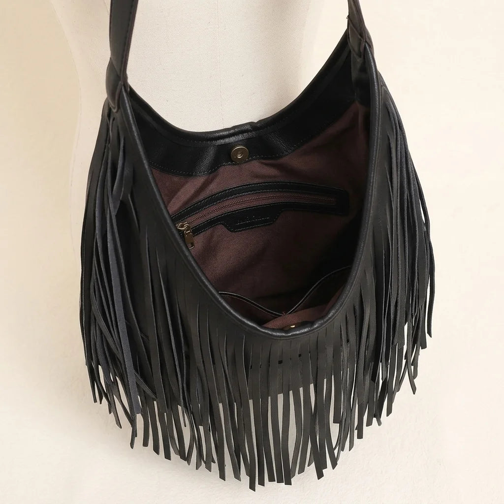 Interior lining and pockets of Black black leather fringe hobo bag