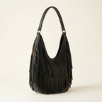 Black black leather fringe hobo bag, three-quarter angle showing side depth