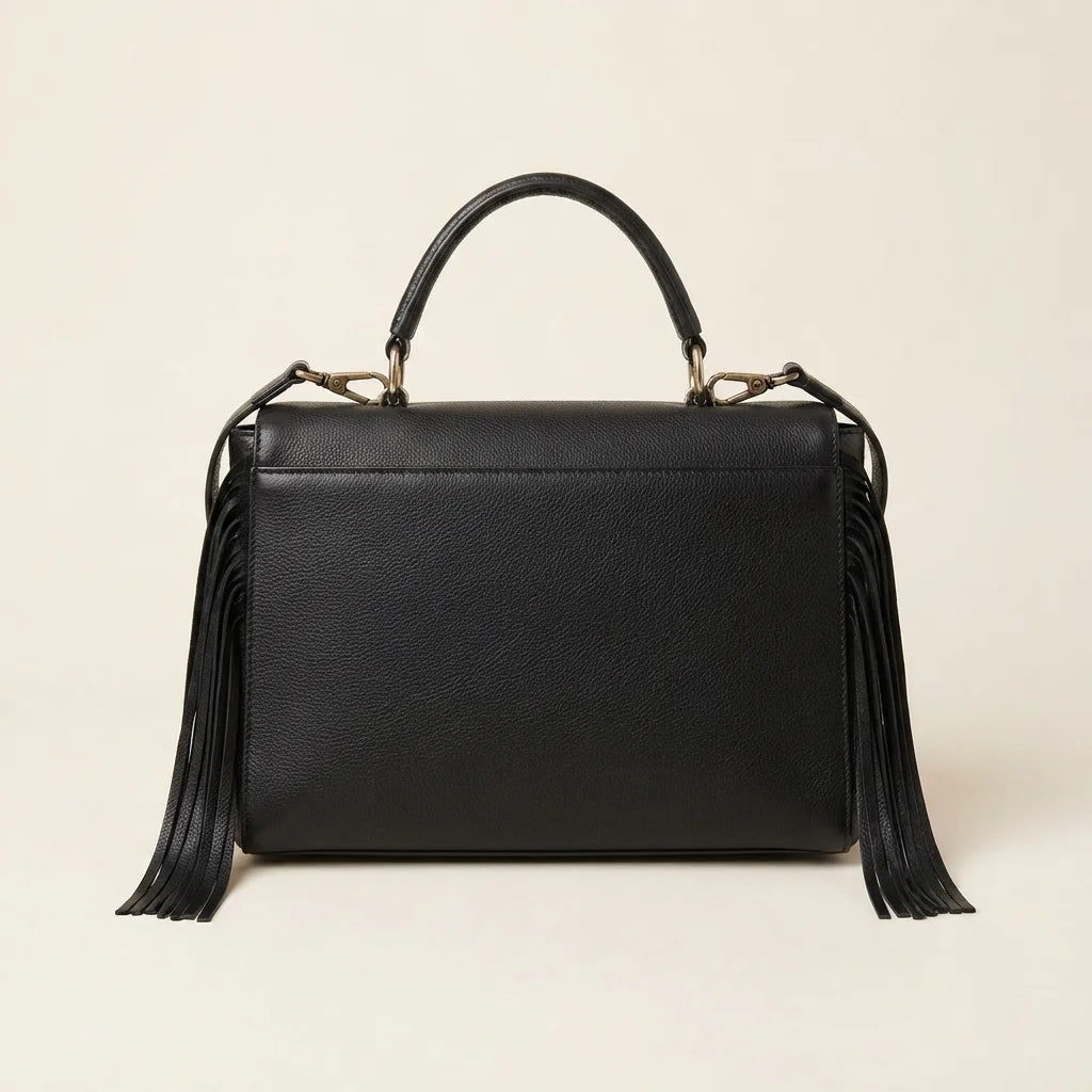 Back panel of Black black leather fringe shoulder bag with strap attachments