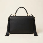 Back panel of Black black leather fringe shoulder bag with strap attachments
