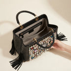 Interior lining and pockets of Black black leather fringe shoulder bag