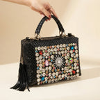 Black black leather fringe shoulder bag, three-quarter angle showing side depth