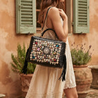 Woman wearing Black black leather fringe shoulder bag with swaying fringe