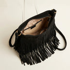 Interior lining and pockets of Black black suede fringe crossbody bag
