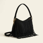 Black black suede fringe crossbody bag, three-quarter angle showing side depth