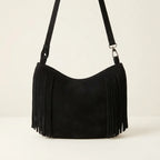 Back panel of Black black suede fringe hobo bag with strap attachments
