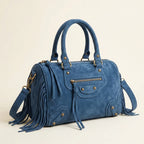 Blue blue crossbody bag fringe, three-quarter angle showing side depth